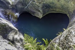 Photo of a natural rock formation creating a perfect heart shape.