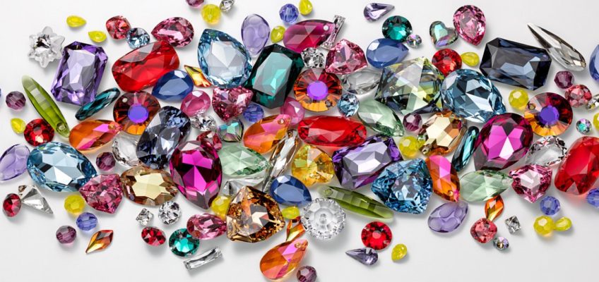 Photo of many colored jewels on a white background